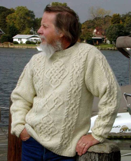 Celtic-Aran Size 41. This sweater combines the warm white wool traditional in the Aran Isles with Celtic knot designs in both the center pattern and its borders. The border pattern is repeated on the sleeves. Size 41.